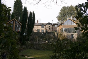 External showing stone house and timber clad extension