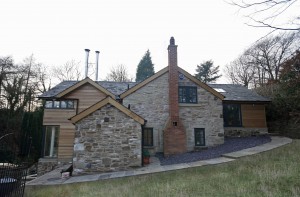 External stone house and timber extensions